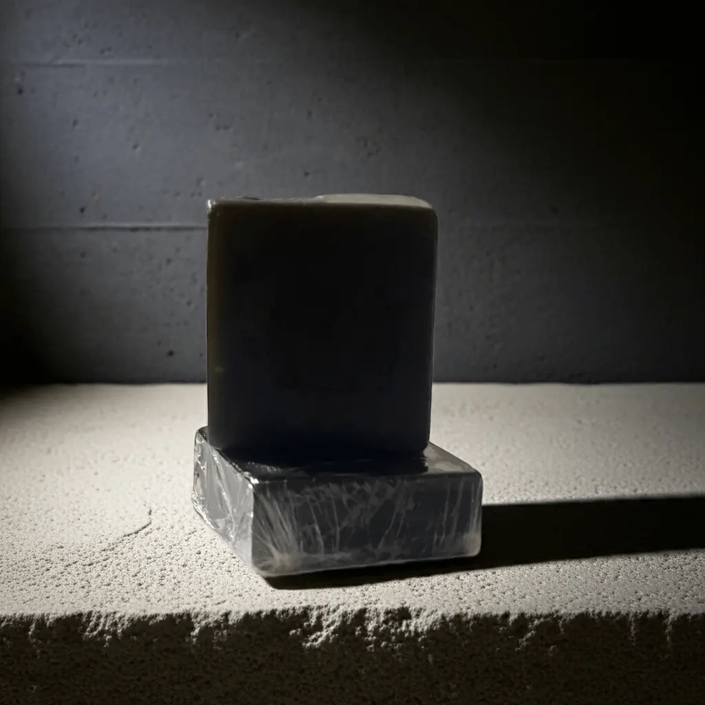 Urban Tree The Black Bar – activated charcoal detox soap in sleek packaging, displayed on stone block.