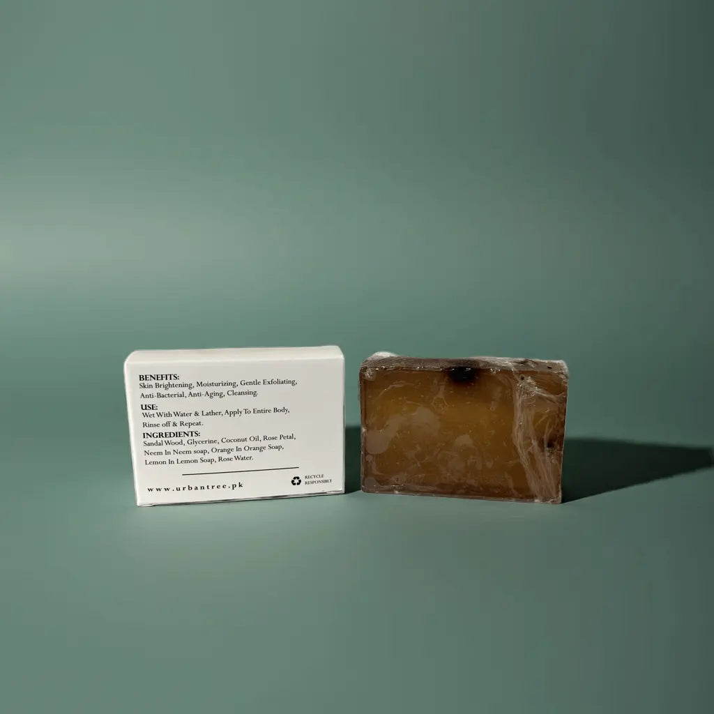 Urban Tree Coffee Glow Soap with back packaging showing ingredients and benefits on green background