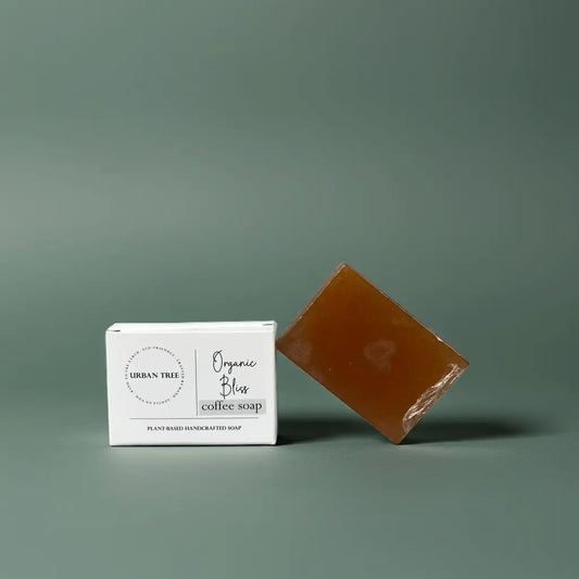 Urban Tree Coffee Glow Soap with packaging box front view on green background