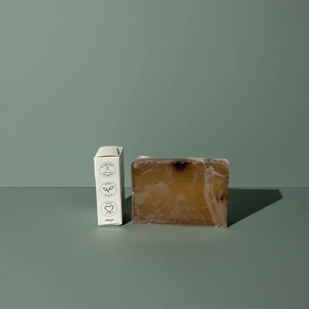 Urban Tree Coffee Glow Soap with side packaging showing eco friendly and vegan icons on green background