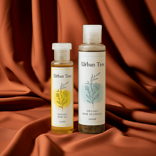 Urban Tree Hair Revival Duo – Organic Hair Oil 100ml and Sulfate Free Shampoo 200ml on brown fabric backdrop – premium organic hair care set in Pakistan