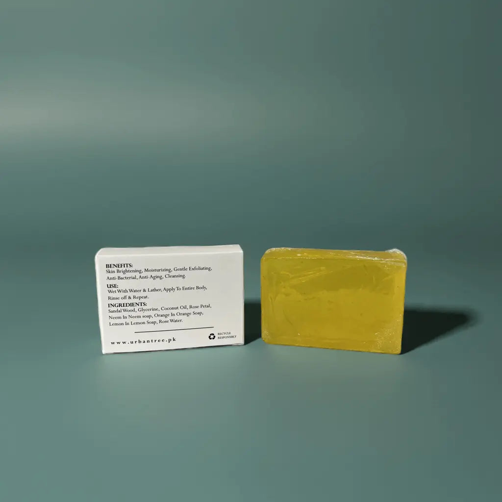 Urban Tree Lemon Citrus Soap with back packaging showing ingredients and benefits on green background