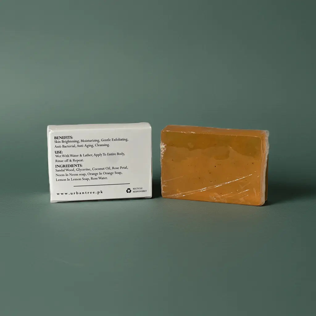 Urban Tree Orange Vitamin C Soap with back packaging showing ingredients and benefits on green background