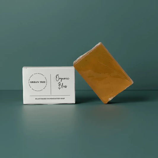Urban Tree Orange Vitamin C Soap with packaging box front view on green background
