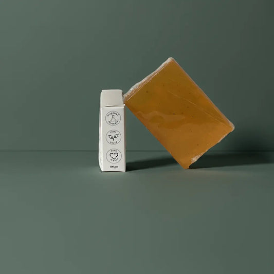 Urban Tree Orange Vitamin C Soap with side packaging showing eco friendly and vegan icons on green background