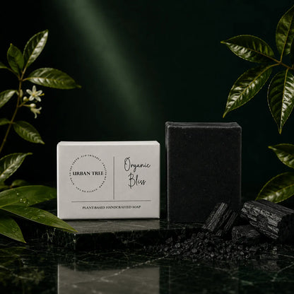 Charcoal Soap handmade detox soap 100g by Urban Tree Pakistan with black charcoal soap bar, charcoal pieces and premium botanical background