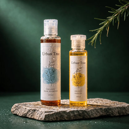 Urban Tree Hair Revival Duo: Organic Shampoo 200ml and Organic Hair Oil with Rosemary 100ml on a stone slab