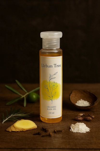 Organic Hair Oil by Urban Tree – premium hair growth oil with coconut, olive, and ginger extracts on wooden background.