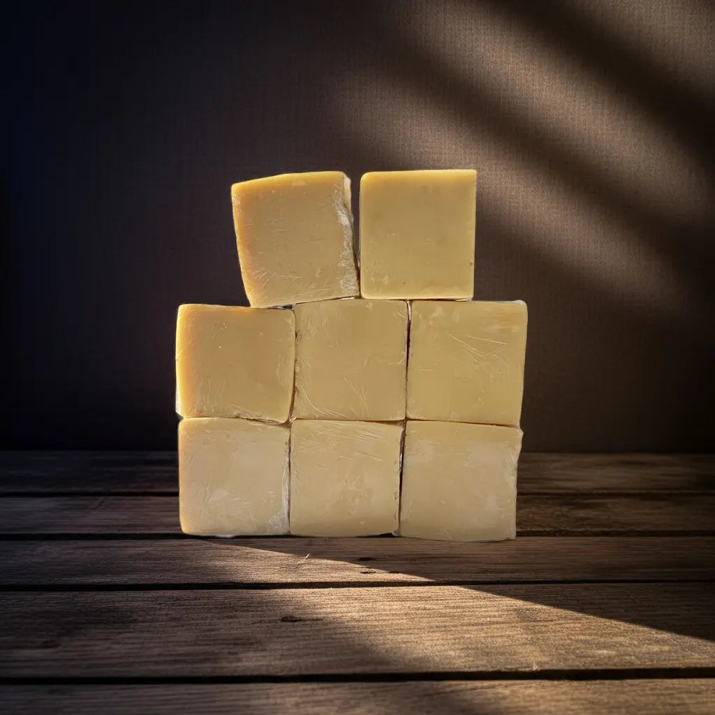 Urban Tree Turmeric and Kojic Acid Brightening Soap collection of premium golden skincare bars stacked on wooden background