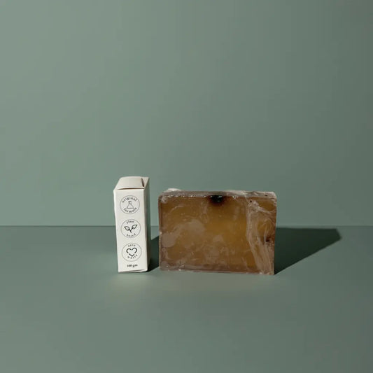 Urban Tree Coffee Glow Soap with side packaging showing eco friendly and vegan icons on green background