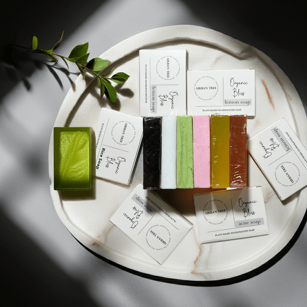 Urban Tree Organic Soap Collection – assorted handmade soaps including neem, lemon, coffee, rice, acne rescue, and orange bars with branded packaging – natural skincare in Pakistan