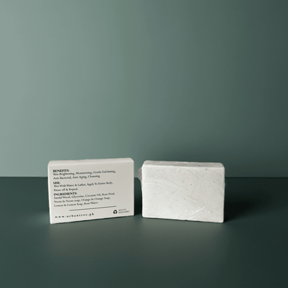 Urban Tree Rice Radiance Soap, skin brightening and moisturizing organic soap with full ingredient list, handmade in Pakistan on a dark surface against a green background